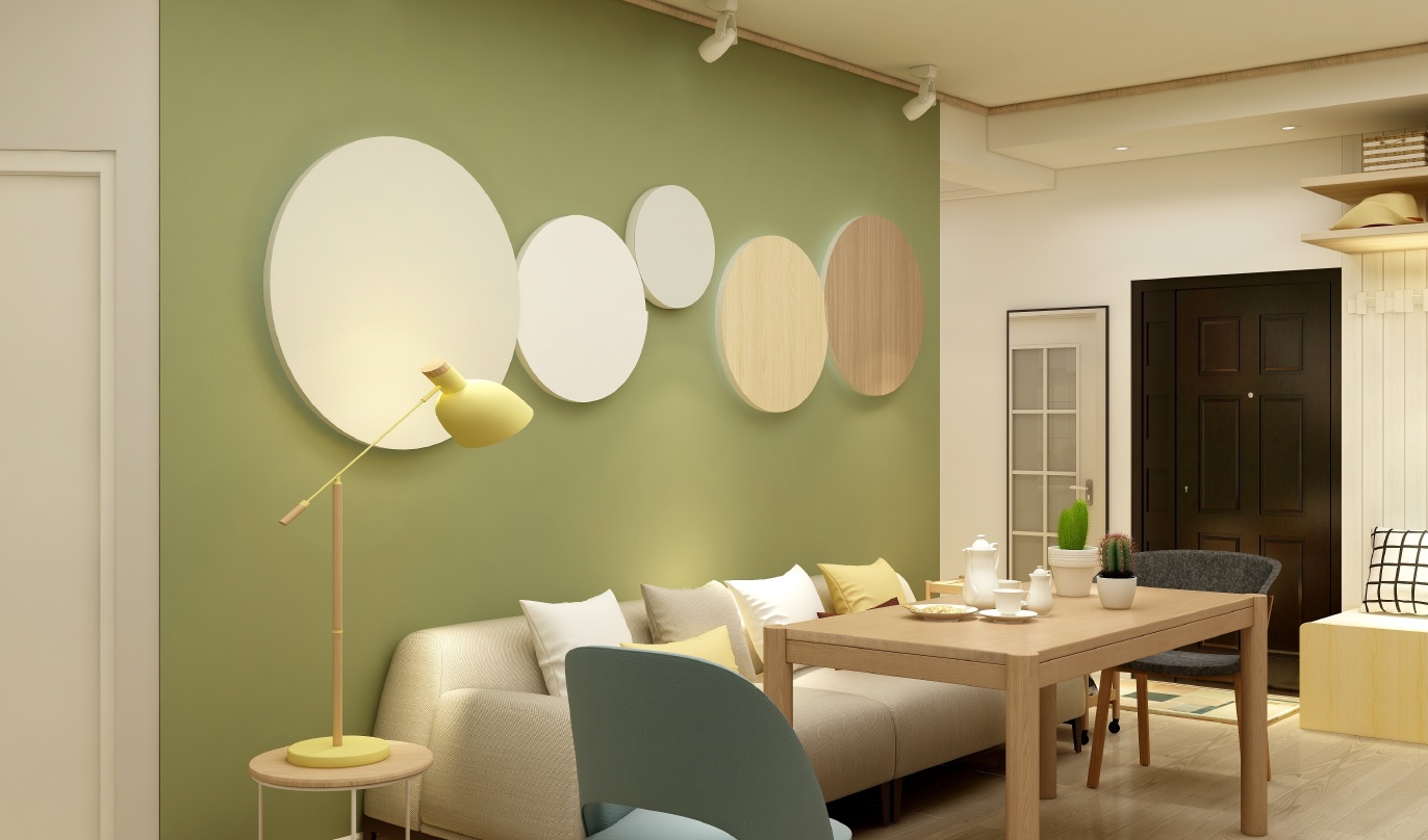 这是一间客厅，整体以绿色和白色为主色调。墙面是绿色的，地面上铺着白色木地板。客厅的家具摆放整齐，色彩搭配和谐。