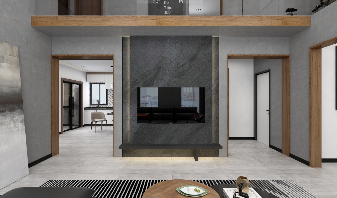 这是一间客厅的3D渲染图，整体色调为黑白灰色调，电视背景墙为黑色大理石纹，电视下方为一排木质柜子，地板为白色大理石纹。客厅的家具包括一个黑色的沙发、一个圆形的木制茶几、一个黑色的坐垫、一个黑色的桌子、几排黑白相间的长条地毯。客厅的左侧是一个开放式的厨房，厨房的地板为黄色木质，橱柜为白色。客厅的右侧有两扇门，门的右侧有一个黑色的包。